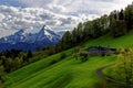 Farmstead in scenic alpine landscape spring season nature Royalty Free Stock Photo