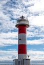 Faro de Fuelcaliente, red-white lighthouse tower on south of La Palma siland, Canary, Spain Royalty Free Stock Photo