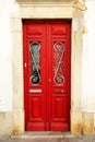 Beautiful red door of house in Faro, Algarve, South of Portugal Royalty Free Stock Photo