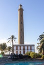 Faro Maspalomas lighthouse with a house in front