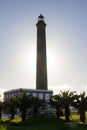 Faro Maspalomas lighthouse with the sun behind Royalty Free Stock Photo