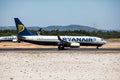 Faro, Portugal - July, 2018: Airliner from Ryanair takes off from Faro international airport FAO during daytime.