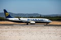 Faro, Portugal - July, 2018: Airliner from Ryanair takes off from Faro international airport FAO during daytime.