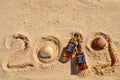 Faro, Portugal - 12/10/2018: Two little bottles Jack Daniels whiskey lie on the sand. New Year luxury alcoholic party, top view