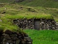 BorÃÂ°oy, abandoned building with grass roof in Muli village