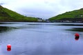 Faroe Islands boat trip, cliffs rocks houses, Denmark Royalty Free Stock Photo