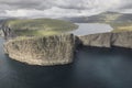 Faroe islands dramatic coastline in Vagar. Leitisvatn lake