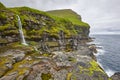 Faroe islands landscape with waterfall and atlantic ocean. Mikladalur, Kalsoy Royalty Free Stock Photo