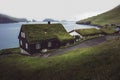 Faroese village with traditional grass roof house. Bour Village. Vagar Island, Faroe Islands. Denmark Royalty Free Stock Photo