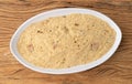 Farofa, typical brazilian manioc flour side dish over wooden table