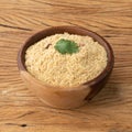 Farofa, typical brazilian manioc flour side dish over wooden table