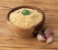 Farofa, typical brazilian manioc flour side dish over wooden table