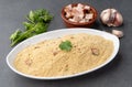 Farofa, typical brazilian manioc flour side dish with seasonings over stone background