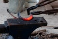 Farrier making horseshoe