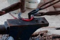 Farrier making horseshoe