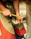 The Farrier, nailing the shoe Royalty Free Stock Photo