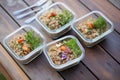 farro salad meal prep in four individual containers