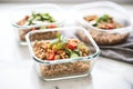 farro salad meal prep in four individual containers