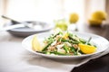 farro salad with steamed asparagus and lemon wedge