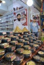 Iranian sweets traders stand near showcase of their store, Shiraz.