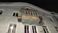 Fasade of house of merchant with balcony at night time