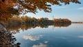 Fascinating autumn view of a lake with swans in bright warm colors in daylight Royalty Free Stock Photo