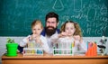 Fascinating biology lesson. Man bearded teacher work with microscope and test tubes in biology classroom. School biology Royalty Free Stock Photo