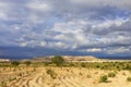 Fascinating landscape of mountain valleys of Cappadocia against the backdrop of thunderstorm clouds of lead-blue sky