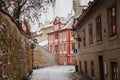 Fascinating narrow picturesque street with baroque and renaissance historical buildings, snow in winter day, Novy svet, New World