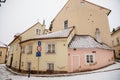 Fascinating narrow picturesque street with baroque and renaissance historical buildings, snow in winter day, Novy svet, New World