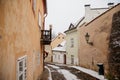 Fascinating narrow picturesque street with baroque and renaissance historical buildings, snow in winter day, Novy svet, New World