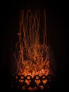 Fascinating spectacle of the bizarre magical dance of sparks and fire in the fireplace insert Royalty Free Stock Photo