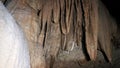 Fascinating speleology. Tit-shaped and lingual stalactites