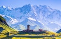 A fascinating view on Ushguli village at the foot of snow-capped Mt. Shkhara. Royalty Free Stock Photo