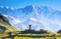 A fascinating view on Ushguli village at the foot of snow-capped Mt. Shkhara. Royalty Free Stock Photo
