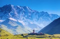 A fascinating view on Ushguli village at the foot of snow-capped Mt. Shkhara. Royalty Free Stock Photo