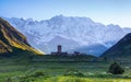 A fascinating view on Ushguli village at the foot of snow-capped Mt. Shkhara. Royalty Free Stock Photo