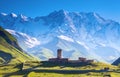 A fascinating view on Ushguli village at the foot of snow-capped Mt. Shkhara. Royalty Free Stock Photo