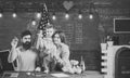 Fashion accessories. American family at desk with son making paper planes. Homeschooling concept. Kid with parents in Royalty Free Stock Photo