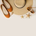 Fashion accessories for the beach - hat, ballet shoes, orange glasses on a white background. Royalty Free Stock Photo