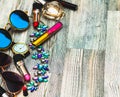 Fashion accessories : black watch, rim glasses and perfume in black feminine beautician. cosmetics near mirror on white