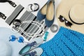 Fashion accessories in black and white and blue colors - hat clothing, shoes and bag, bracelets and glasses.