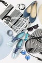 Fashion accessories in black and white and blue colors - hat clothing, shoes and bag, bracelets and glasses. Royalty Free Stock Photo