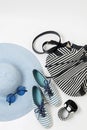 Fashion accessories in black and white and blue colors - hat clothing, shoes and bag, bracelets and glasses. Royalty Free Stock Photo