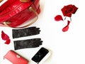 Fashion accessories red handbag wallet gloves sunglasses on white background roses petal luxury clothes for women Royalty Free Stock Photo