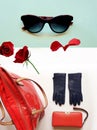 Fashion accessories red handbag wallet gloves sunglasses on white background roses petal luxury clothes for women Royalty Free Stock Photo