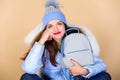 Fashion accessory. Little backpack and knitted hat. Total pastel outfit. Backpack is all you need. Girl adorable model