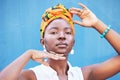 Fashion, Africa and portrait of black woman on blue background with natural beauty, glowing skin and makeup. Hands frame