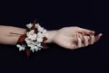 Fashion art hand woman in summer time and flowers on her hand with bright contrasting makeup. Creative beauty photo hand girls Royalty Free Stock Photo