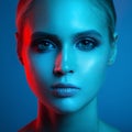 Fashion art portrait of beautiful woman face. Red and blue light Royalty Free Stock Photo